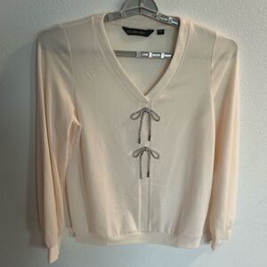 Colleen Lopez Women’s Cream Sweater with 2 Bows in Silver Rhinestone. 

Size M